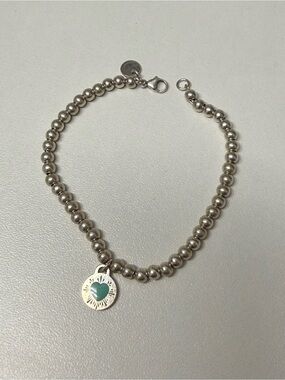 Tiffany & Co. Silver Beaded Bracelet with Teal Heart Accent